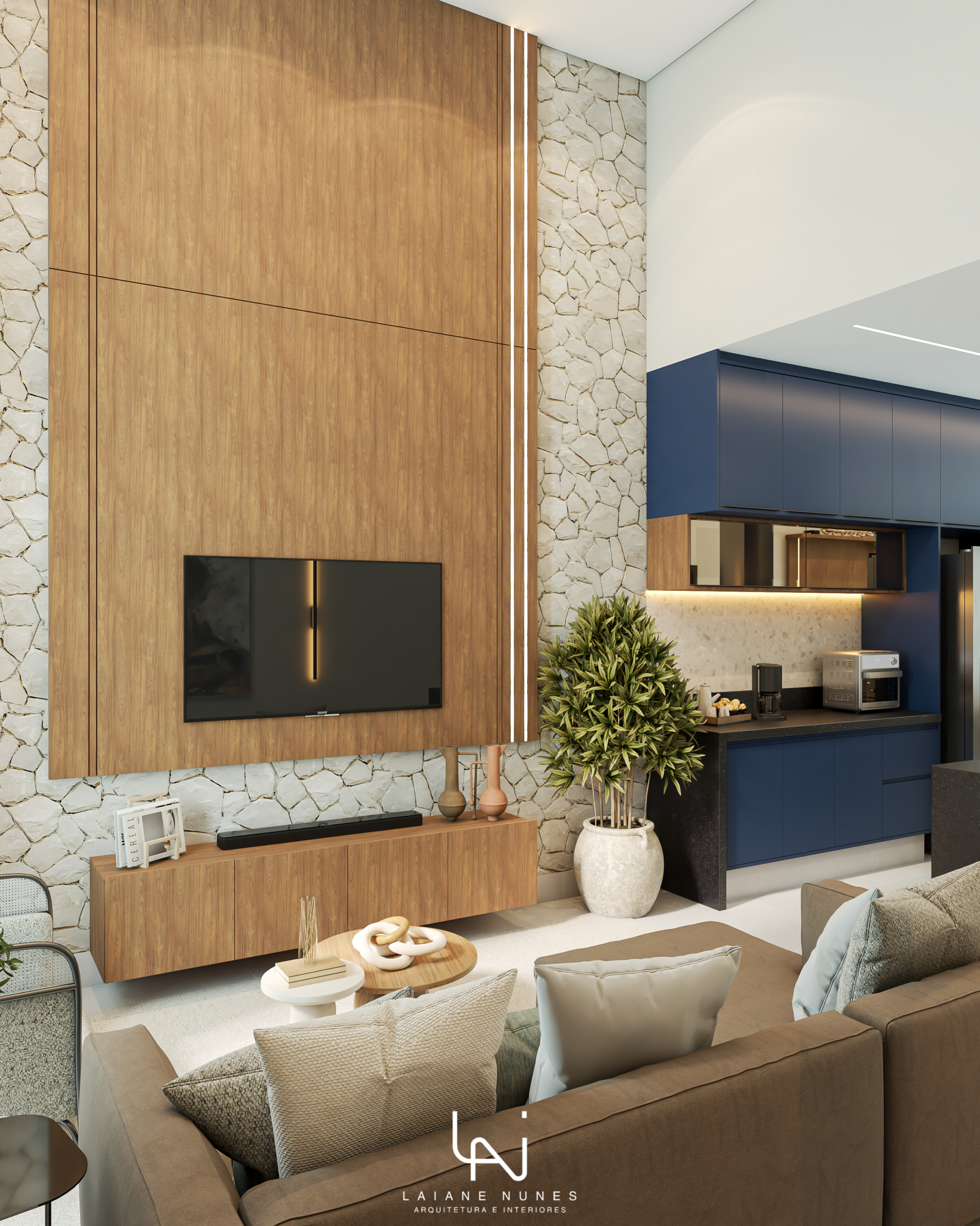 a imagem mostra o projeto de interiores de uma área social para uma casa de alto padrão em Piracicaba, compreendendo sala de estar com sofá em frente à tv e parte cozinha decorada com armários na cor azul